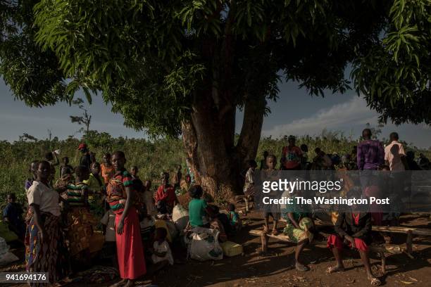 Congolese refugees wait to be assigned a space in the Kyangwali refugee resettlement camp in Uganda on March 23, 2018. Violence in Ituri Province in...