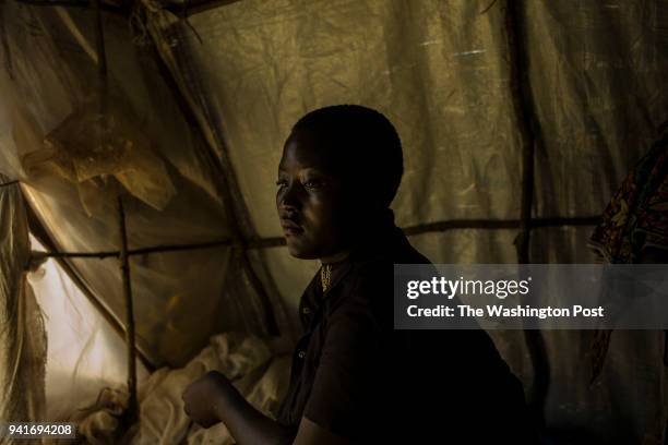 Mapenzi Dzanina at her family's tent in Kyangwali refugee resettlement camp in Uganda on March 23, 2018. "We had heard that the Balendu were coming...