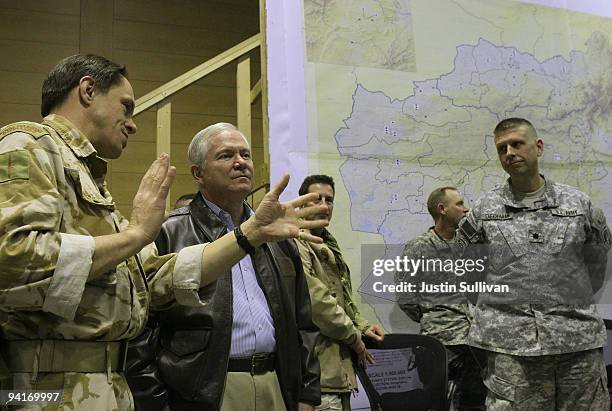 Secretary of Defense Robert Gates is briefed while visiting the I.J.P. At Kabul International Airport December 9, 2009 in Kabul, Afghanistan....