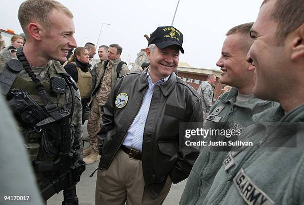 Secretary of Defense Robert Gates jokes with U.S. Army troops while visiting Kabul International Airport December 9, 2009 in Kabul, Afghanistan....