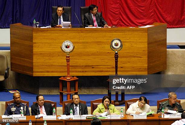 Senate President Juan Ponce Enrile and House of Representatives Speaker Prospero Nograles listen to the ongoing debate at the House of...