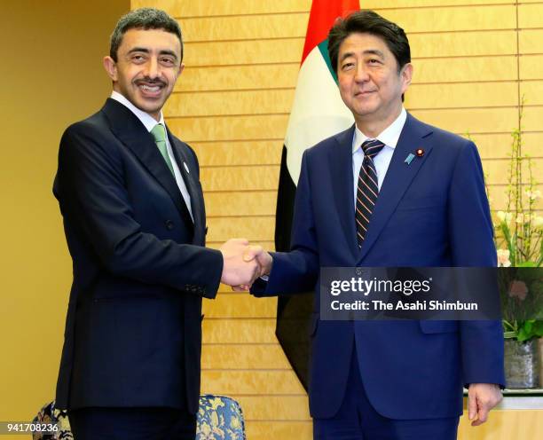 Sheikh Abdullah bin Zayed Al Nahyan, Minister of Foreign Affairs & International Cooperation of the United Arab Emirates shakes hands with Japanese...