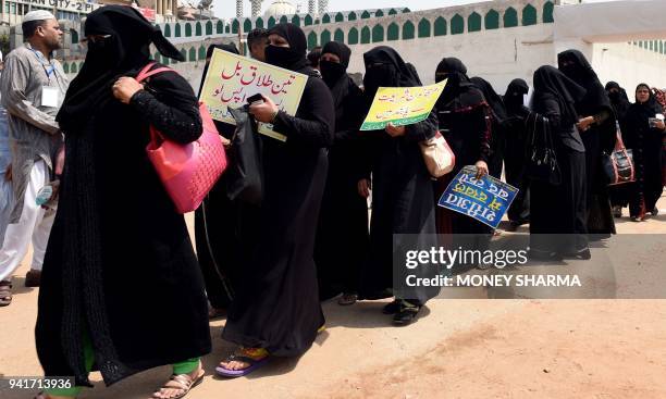 Indian Muslim women take part in a protest against the "triple talaq bill" in New Delhi on April 4, 2018. Muslim women in India have gathered to...