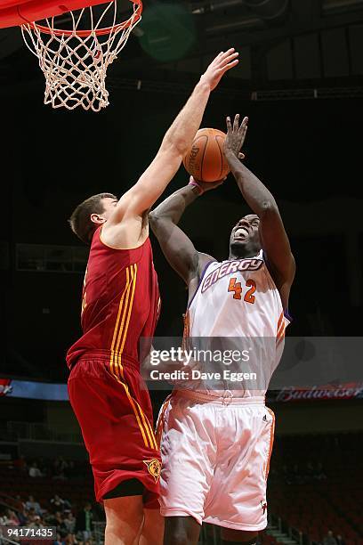 Earl Barron of the Iowa Energy shoots the ball against Rob Kurz of the Fort Wayne Mad Ants during the D-League game on December 3, 2009 at Wells...