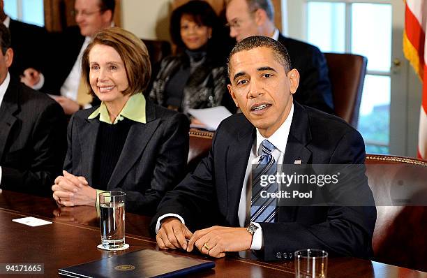 President Barack Obama speaks during a cabinet meeting as House Speaker Nancy Pelosi looks on at the White House on December 9, 2009 in Washington,...