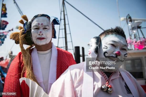 Local fishermen with their faces painted posed for a photo during Ose Matsuri/festival held at the Uchiura fishing port, in Osezaki district of...