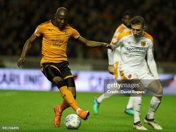 Benik Afobe of Wolverhampton Wanderers controls the ball watched by Angus MacDonald during the Sky Bet Championship match between Wolverhampton...