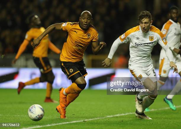 Benik Afobe of Wolverhampton Wanderers controls the ball watched by Angus MacDonald during the Sky Bet Championship match between Wolverhampton...