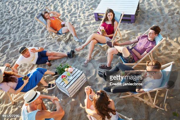 group of friends on a picnic. urban beach - beach club stock pictures, royalty-free photos & images