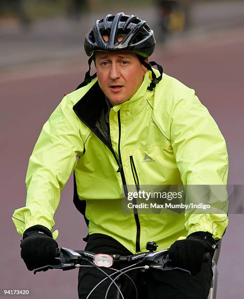 Conservative Leader, David Cameron cycles to the House of Commons on December 9, 2009 in London, England.