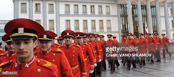 Members of a Georgian honor guard line up in expectation of President Mikheil Saakashvili and his Latvian counterpart Valdis Zatlers in Tbilisi on...
