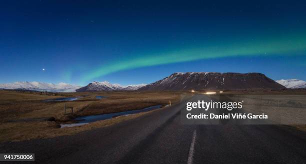 road and aurora borealis, iceland - olafsvik stock pictures, royalty-free photos & images