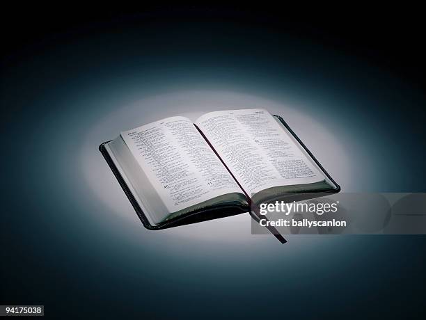 an open bible. - bibel stock-fotos und bilder