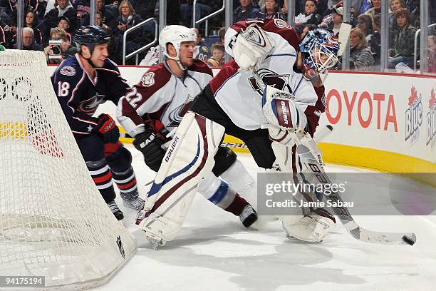 Goaltender Peter Budaj of the Colorado Avalanche plays the puck against the Columbus Blue Jackets on December 5, 2009 at Nationwide Arena in...