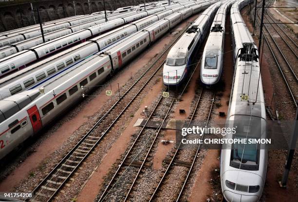 High speed trains stand stationery on tracks outside the Gare de Lyon tran station on April 4, 2018 in Paris, on the second day of three months of...