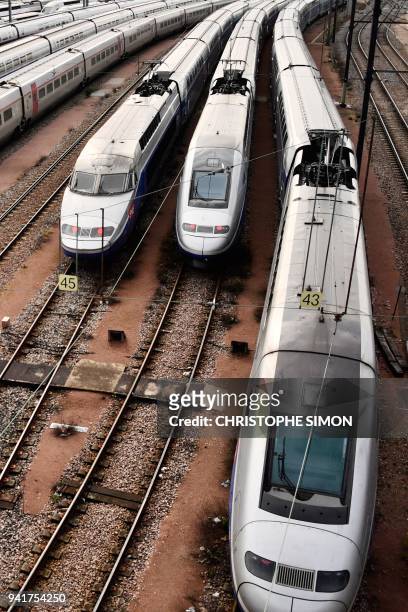 High speed trains stand stationery on tracks outside the Gare de Lyon tran station on April 4, 2018 in Paris, on the second day of three months of...