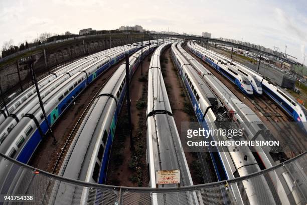 High speed trains stand stationery on tracks outside the Gare de Lyon train station on April 4, 2018 in Paris, on the second day of three months of...