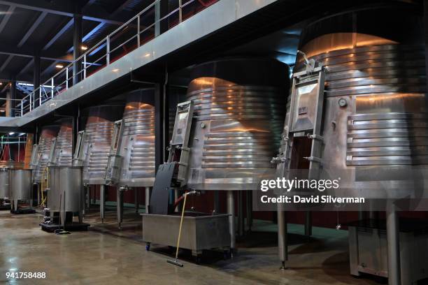 Fermentation tanks sit below the grape processing levels at Aalto winery's modern gravitation facility on October 11, 2016 in Quintanilla de Arriba,...