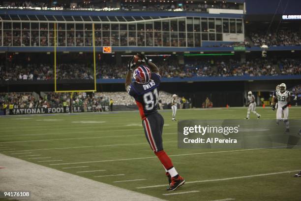 Wide Receiver Terrell Owens of the Buffalo Bills has a sideline catch when the New York Jets face the Buffalo Bills at Rogers Centre on December 3,...