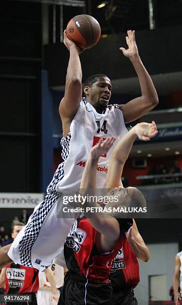 Lietuvos Rytas's Steponas Babrauskas vies with Entente Orleanaise's Ludovic Vaty during their Euroleague Championship basketball match on December 9,...