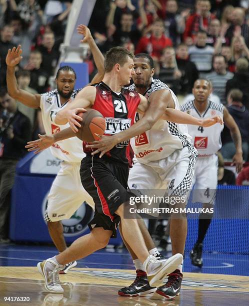 Lietuvos Rytas's Arturas Jomantas vies with Entente Orleanaise's Ludovic Vaty during their Euroleague Championship basketball match on December 9,...