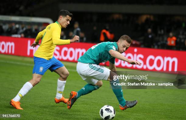 Joshua Kimmich Deutschland Germany Philippe Coutinho Brasilien Brazil at Olympiastadion on March 27, 2018 in Berlin, Germany.