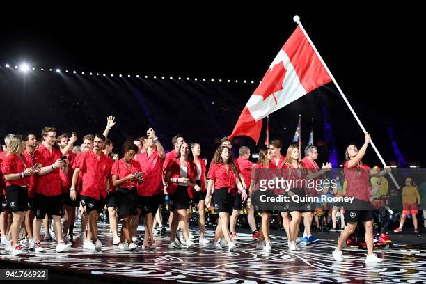 Meaghan Benfeito, flag bearer of Canada arrives with the Canadian team during the Opening Ceremony for the Gold Coast 2018 Commonwealth Games at...