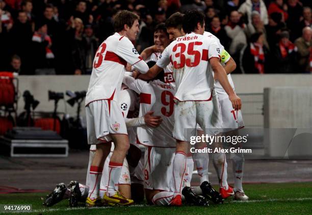 Pavel Pogrebnyak of Stuttgart celebrates his team's third goal with team mates during the UEFA Champions League Group G match between VfB Stuttgart...