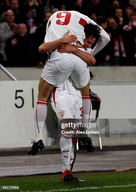 Christian Traesch of Stuttgart celebrates his team's second goal with team mate Ciprian Marica during the UEFA Champions League Group G match between...