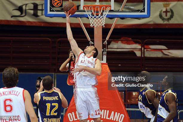 Mason Rocca, #12 of Armani Jeans Milano dunks over Jasmin Perkovic, #12 of EWE Baskets Oldenburg during the Euroleague Basketball Regular Season...