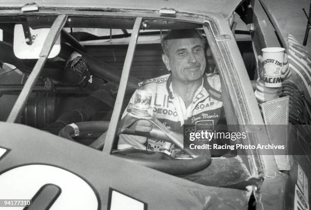 Dave Marcis takes time out for some lemonade after crashing his car after 362 laps. He would take home $5,100 for the Budweiser 500.