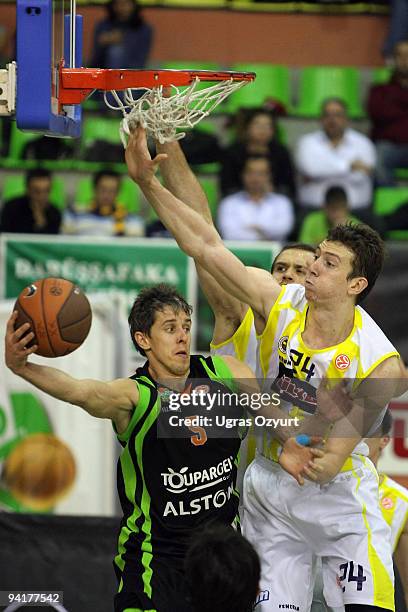 Mindaugas Lukauskis, #5 of Asvel Basket Lyon Villeurbane competes with and Omer Asik, #24 of Fenerbahce Ulker Istanbul competes with in action during...