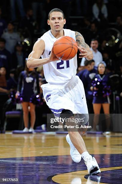 Guard Denis Clemente of the Kansas State Wildcats brings the ball up court against the Xavier Musketeers in the second half on December 8, 2009 at...