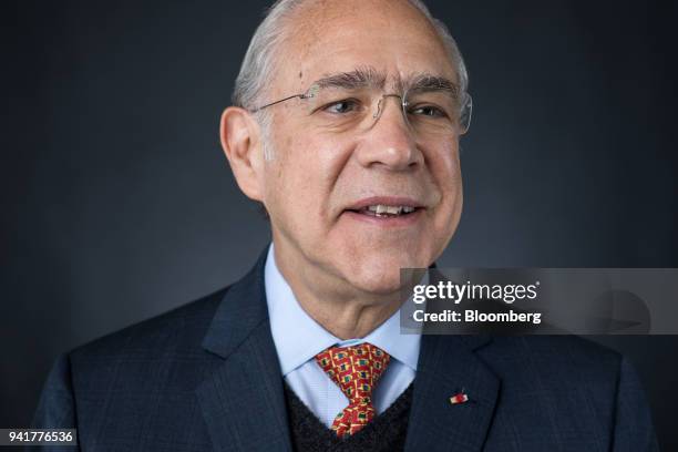 Jose Angel Gurria, secretary-general of the Organization for Economic Cooperation and Development , poses for a photograph before a Bloomberg...