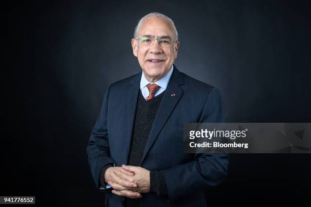Jose Angel Gurria, secretary-general of the Organization for Economic Cooperation and Development , poses for a photograph before a Bloomberg...