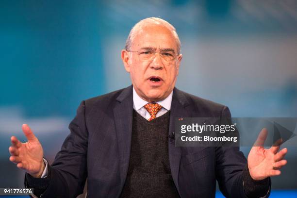 Jose Angel Gurria, secretary-general of the Organization for Economic Cooperation and Development , gestures as he speaks during a Bloomberg...