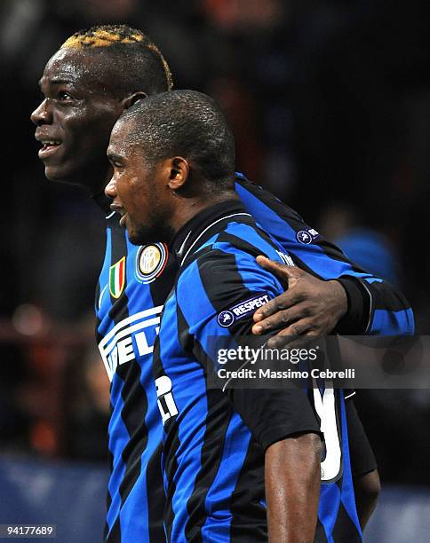 Samuel Eto'o Fils of FC Inter Milan celebrates scoring the opening goal with team mate Mario Balotelli during the UEFA Champions League Group F match...