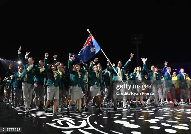 Mark Knowles, flag bearer of Australia arrives with the Australia team during the Opening Ceremony for the Gold Coast 2018 Commonwealth Games at...