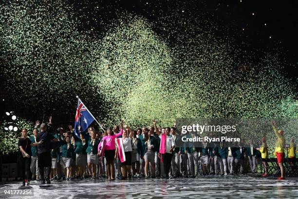 Mark Knowles, flag bearer of Australia arrives with the Australia team during the Opening Ceremony for the Gold Coast 2018 Commonwealth Games at...