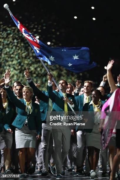 Mark Knowles, flag bearer of Australia arrives with the Australia team during the Opening Ceremony for the Gold Coast 2018 Commonwealth Games at...