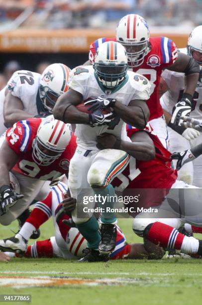 Ricky Williams of the Miami Dolphins carries the ball during a NFL game against the New England Patriots at Land Shark Stadium on December 6, 2009 in...