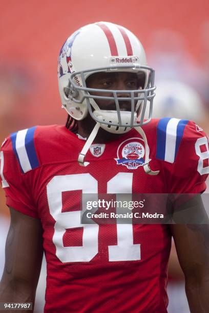 Randy Moss of the New England Patriots looks on during warm-ups before a NFL game against the Miami Dolphins at Land Shark Stadium on December 6,...