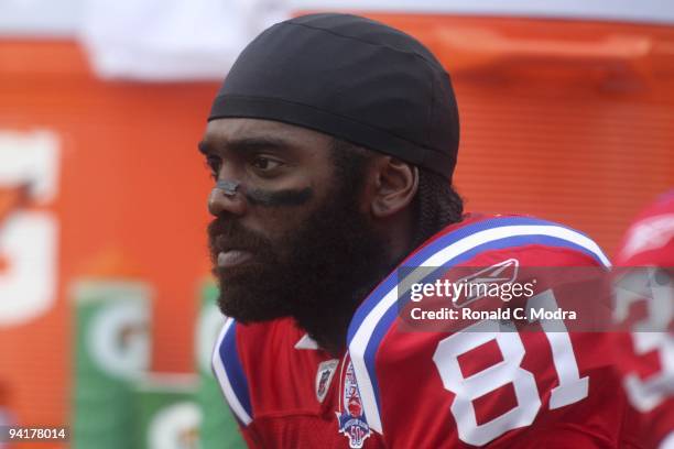 Randy Moss of the New England Patriots sits on the bench during a NFL game against the Miami Dolphins at Land Shark Stadium on December 6, 2009 in...