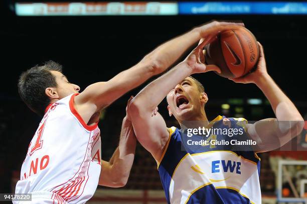 Marko Scekic, #4 of EWE Baskets Oldenburg puts up a shot competing with Massimo Bulleri, #11 of Armani Jeans Milano in action during the Euroleague...