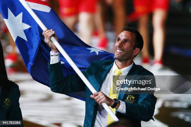 Australian Flagbearer Mark Knowles walks around with the team during the Opening Ceremony for the Gold Coast 2018 Commonwealth Games at Carrara...