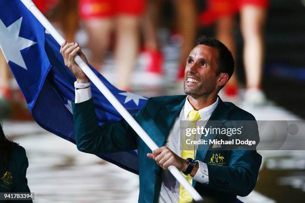 Australian Flagbearer Mark Knowles walks around with the team during the Opening Ceremony for the Gold Coast 2018 Commonwealth Games at Carrara...