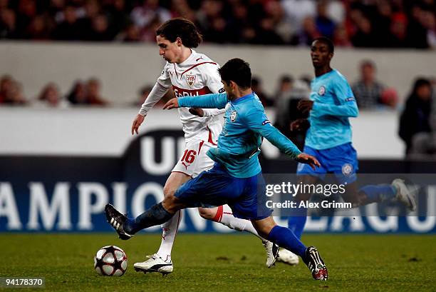 Sebastian Rudy of Stuttgart is challenged by Razvan Paduretu of Unirea during the UEFA Champions League Group G match between VfB Stuttgart and...