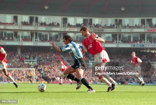 March 1998 London, Premier League Football, Arsenal v Sheffield Wednesday - Paolo di Canio of Wednesday shields the ball from Tony Adams of Arsenal