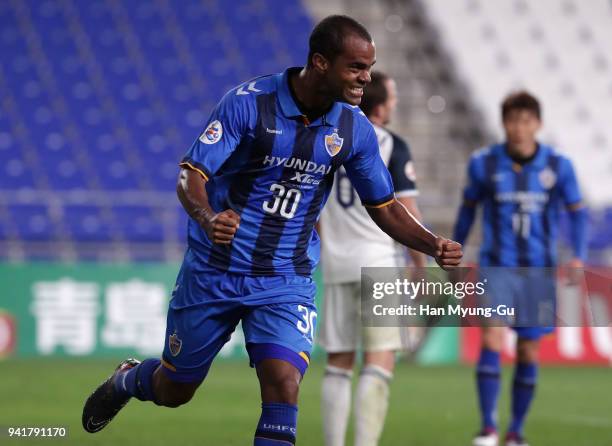 Junior Negrao of Ulsan Hyndai celebrates scoring his side's fifth goal during the AFC Champions League Group F match between Ulsan Hyundai and...