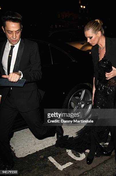 Jamie Hince steps on girlfriends Kate Moss dress as she arrives at the British Fashion Awards at The Royal Courts of Justice on December 9, 2009 in...